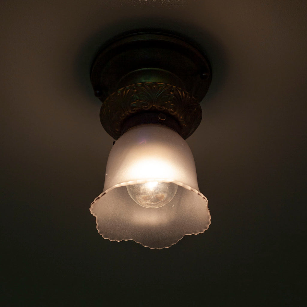 Light fixture lit up with bulb